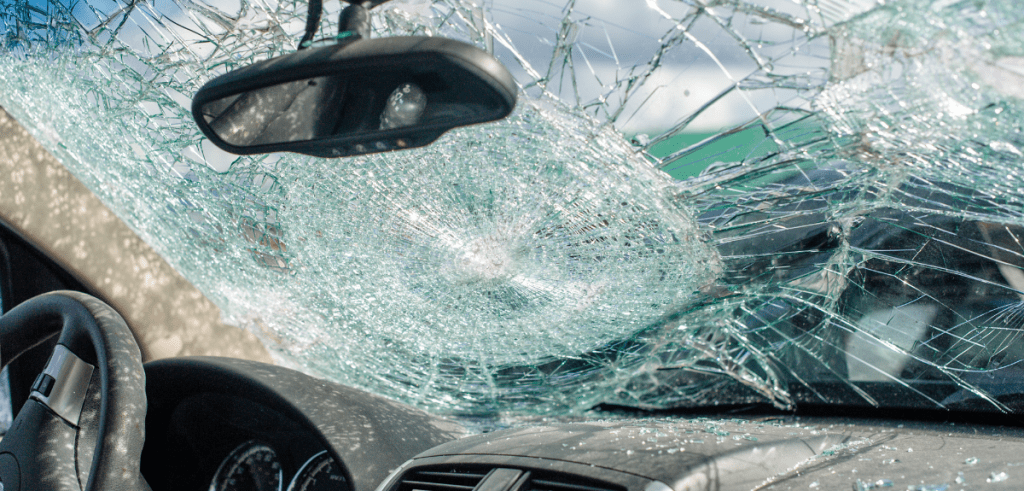 A car with a smashed windshield