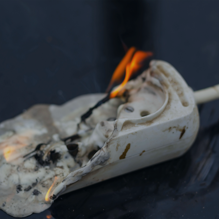 A power strip that has caught on fire